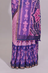 Pink geometric ikkat design linen cotton saree with contrast zari border and printed blouse