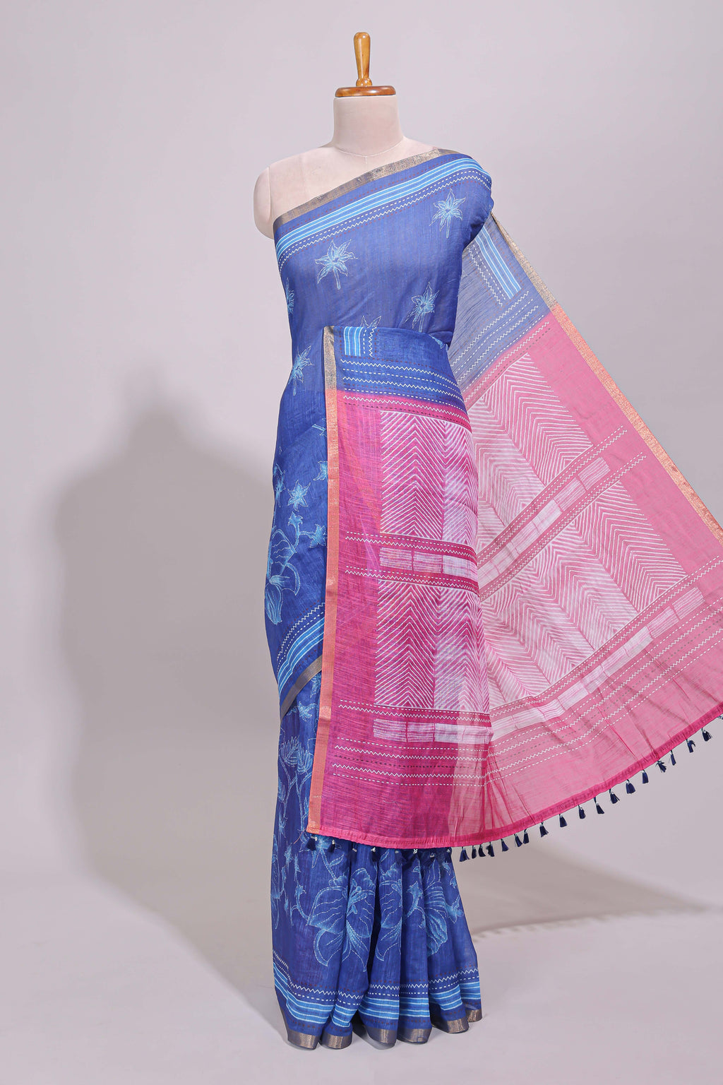 Blue floral design linen cotton saree with self zari border and contrast printed blouse