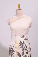 Cream floral design linen cotton saree with self zari border and contrast printed blouse