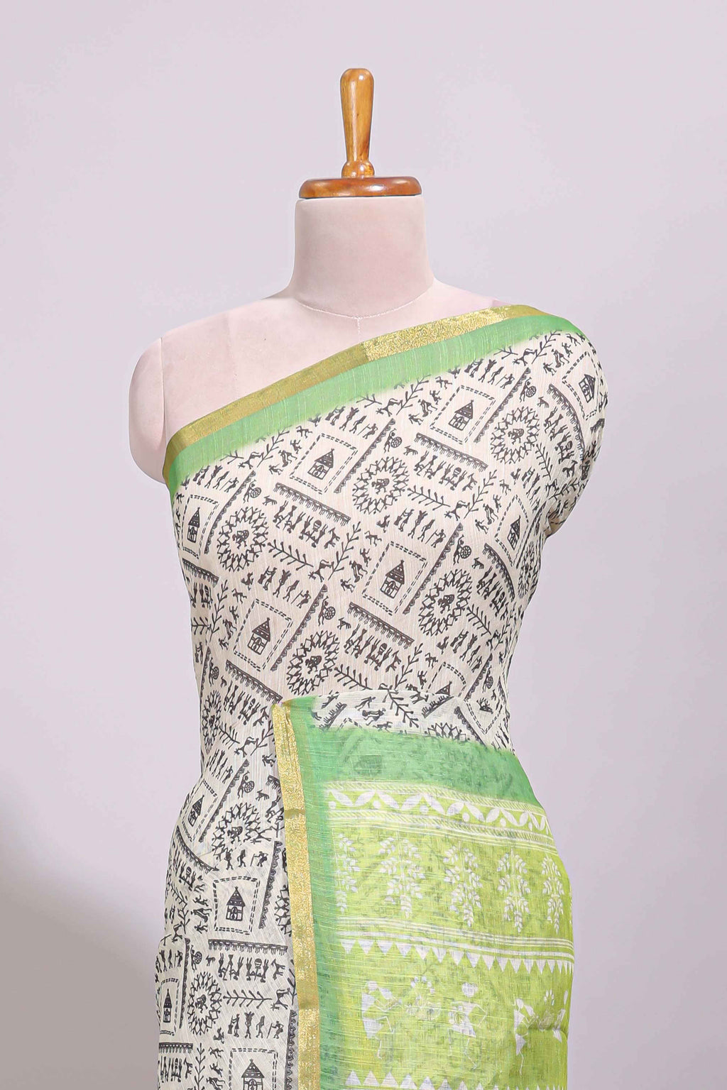 Cream warli design linen cotton saree with contrast zari border and printed blouse
