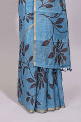 Blue floral design linen cotton saree with self zari border and contrast printed blouse