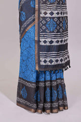 Blue crack design linen cotton saree with contrast zari border and printed blouse