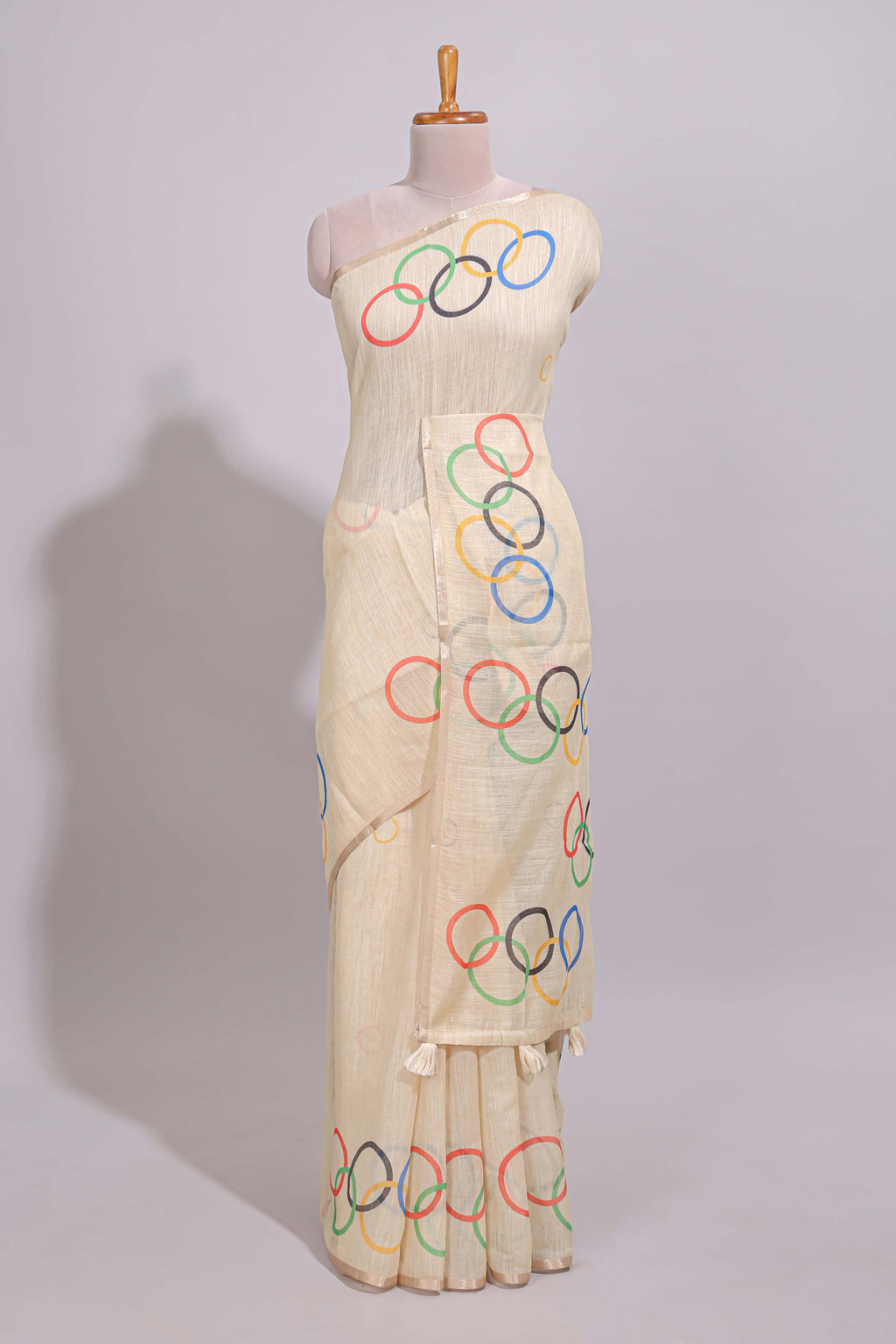 Cream olympic logo design linen cotton saree with self zari border and matching printed blouse