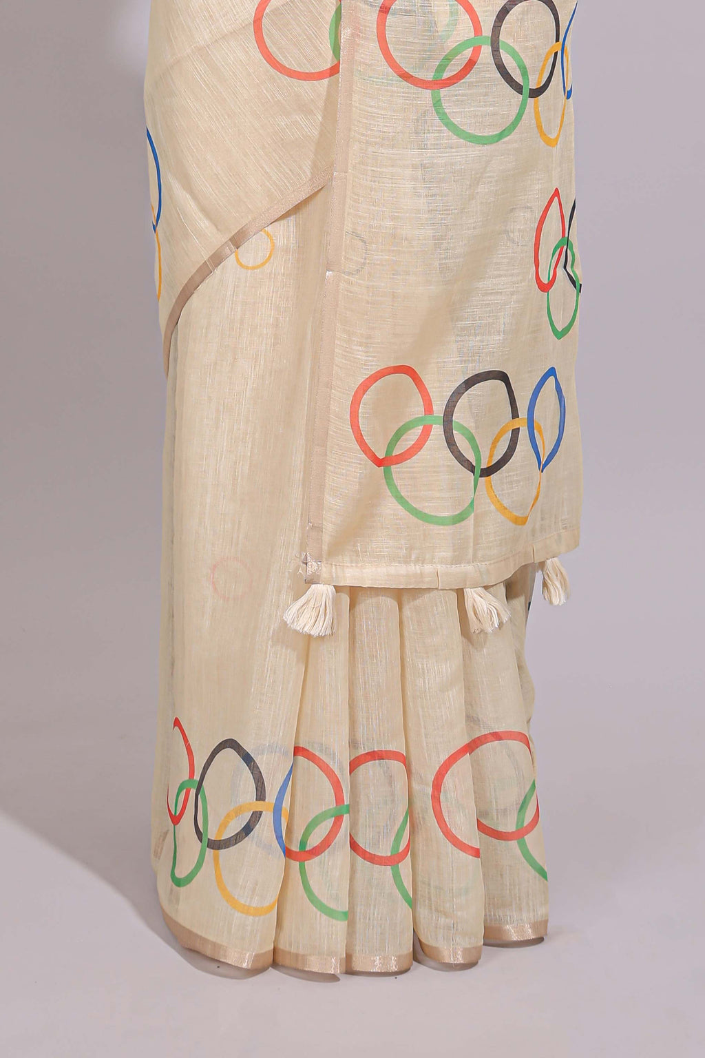 Cream olympic logo design linen cotton saree with self zari border and matching printed blouse