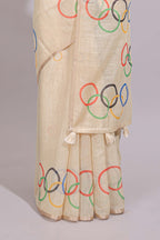 Cream olympic logo design linen cotton saree with self zari border and matching printed blouse