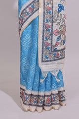 Blue floral print motifs linen cotton saree with contrast zari border and printed motifs blouse