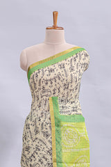 Beige tribal design warli print linen cotton saree with contrast green zari border and chevron design blouse