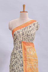 Beige tribal design warli print linen cotton saree with contrast orange zari border and warli design blouse