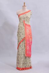 Beige tribal design warli print linen cotton saree with contrast pink zari border and floral design pallu