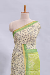 Beige tribal design warli print linen cotton saree with contrast green zari border and floral design pallu