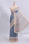 Steel blue checked motifs design linen cotton saree with contrast zari border and printed blouse