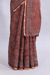 Maroon floral vines design linen cotton saree with self zari border and matching motifs blouse
