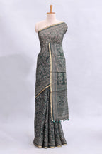 Bottle green floral vines design linen cotton saree with self zari border and matching motifs blouse