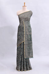 Bottle green floral vines design linen cotton saree with self zari border and matching motifs blouse