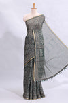 Bottle green floral vines design linen cotton saree with self zari border and matching motifs blouse