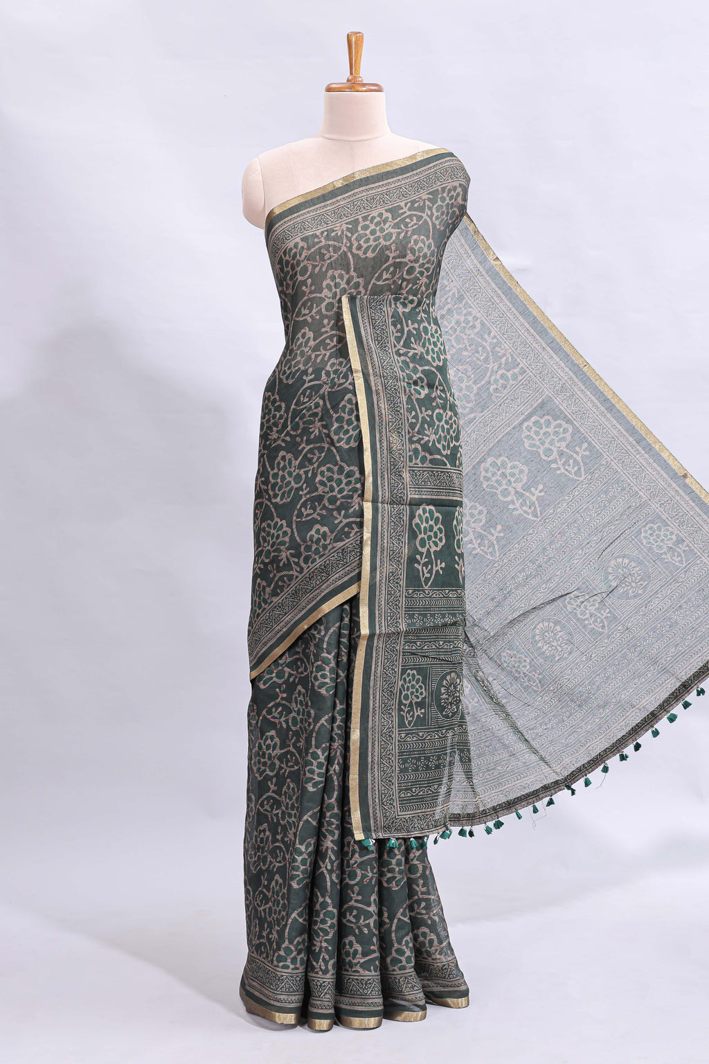 Bottle green floral vines design linen cotton saree with self zari border and matching motifs blouse