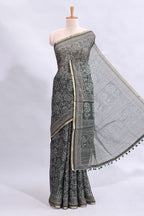Bottle green floral vines design linen cotton saree with self zari border and matching motifs blouse