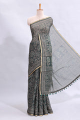 Bottle green floral vines design linen cotton saree with self zari border and matching motifs blouse