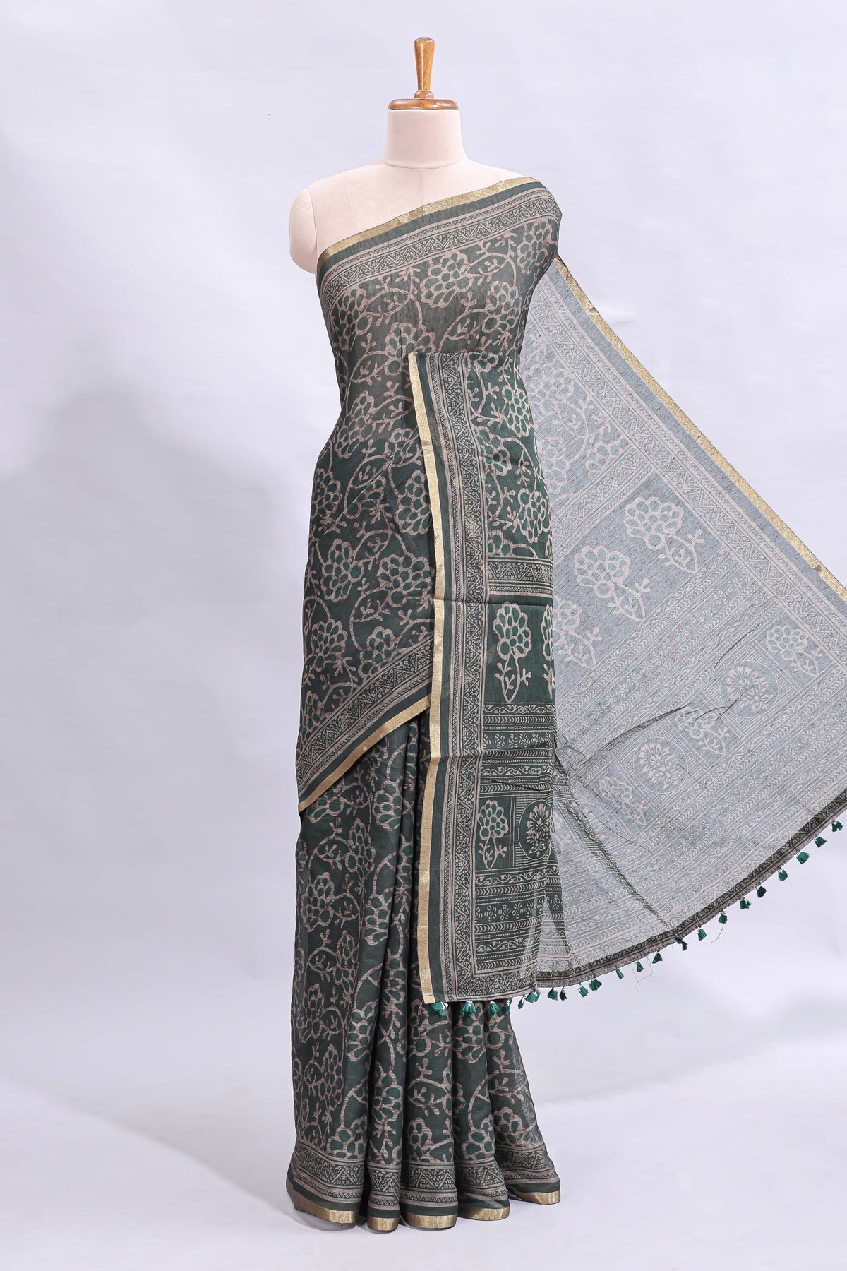 Bottle green floral vines design linen cotton saree with self zari border and matching motifs blouse