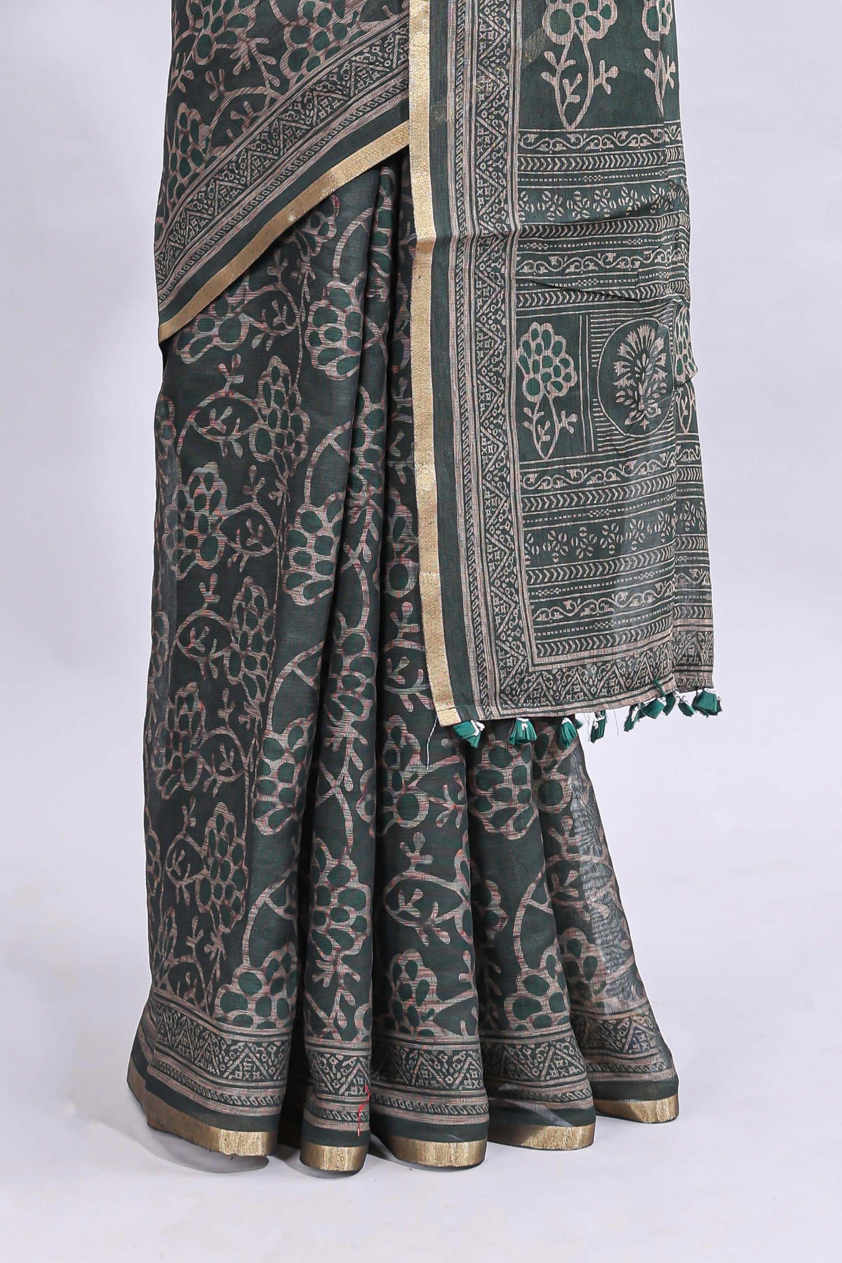 Bottle green floral vines design linen cotton saree with self zari border and matching motifs blouse