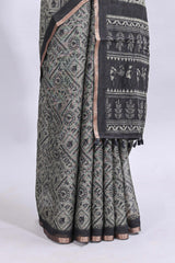 Grey warli tribe design linen cotton saree with contrast zari border and printed blouse