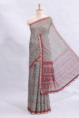 Grey warli tribe design linen cotton saree with contrast zari border and printed blouse