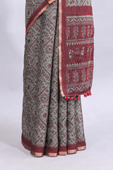 Grey warli tribe design linen cotton saree with contrast zari border and printed blouse