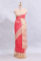 Pink checked linen cotton saree with contrast border and striped blouse
