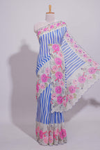 White Linen saree with blue stripes and vibrant pink floral scallop border with contrast printed blouse