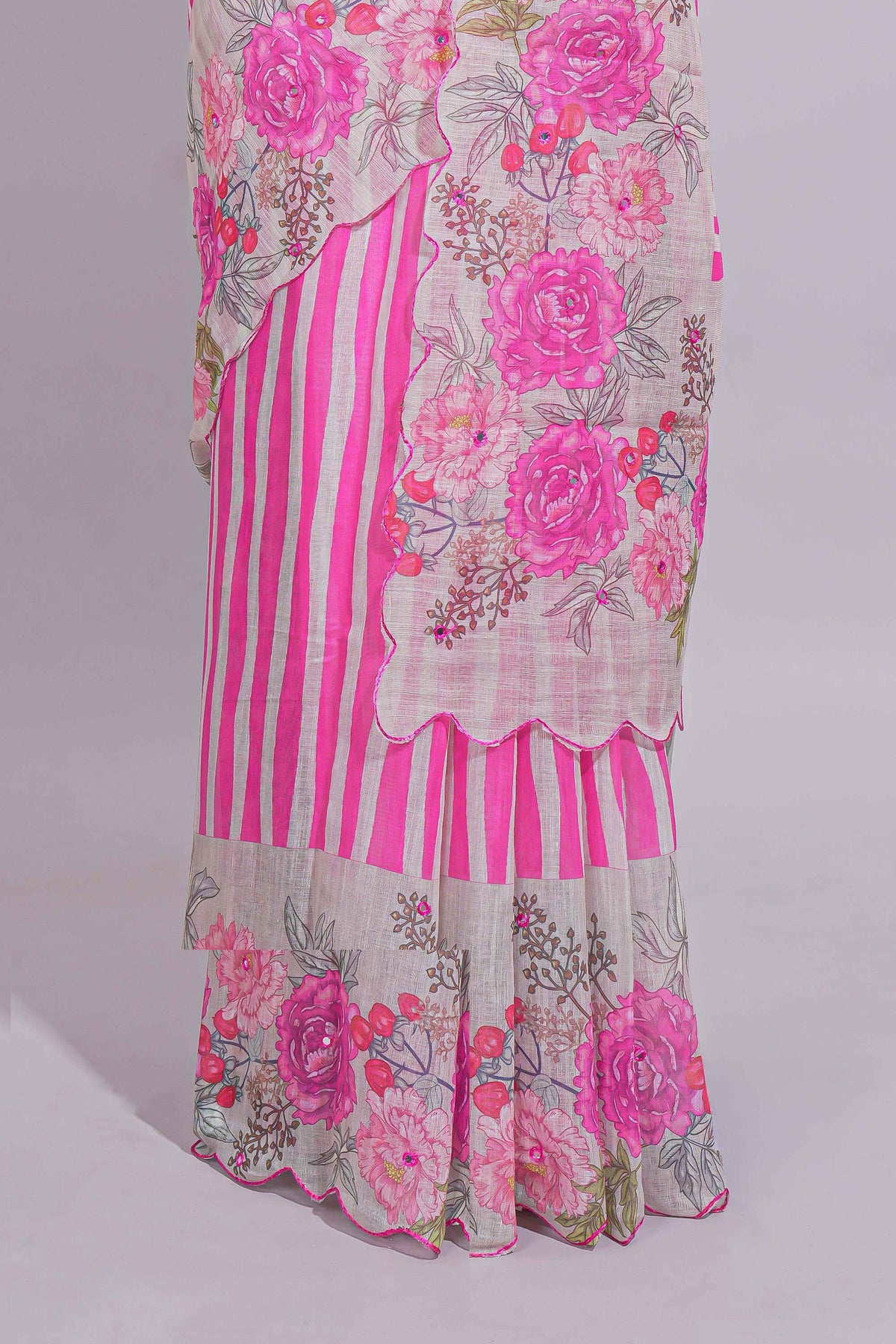 White Linen saree with pink stripes and vibrant pink floral scallop border with contrast printed blouse
