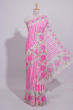 White Linen saree with pink stripes and vibrant pink floral scallop border with contrast printed blouse