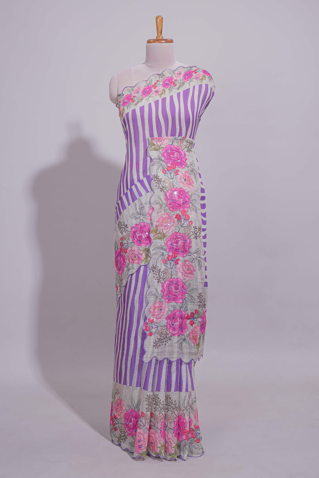 White Linen saree with violet stripes and vibrant pink floral scallop border with contrast printed blouse