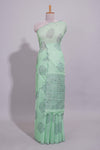 Pastel green linen saree tree motifs and tiny sequin with scalloped border and matching blouse