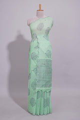 Pastel green linen saree tree motifs and tiny sequin with scalloped border and matching blouse