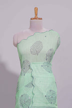 Pastel green linen saree tree motifs and tiny sequin with scalloped border and matching blouse