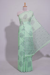 Pastel green linen saree tree motifs and tiny sequin with scalloped border and matching blouse