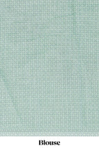 Pastel green linen saree tree motifs and tiny sequin with scalloped border and matching blouse
