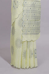 Pastel yellow linen saree tree motifs and tiny sequin with scalloped border and matching blouse