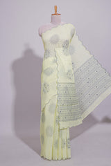 Pastel yellow linen saree tree motifs and tiny sequin with scalloped border and matching blouse