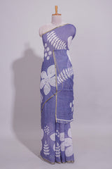 Tropical indigo linen saree with bold white floral and geometric prints finished with a subtle metallic border along with matching blouse
