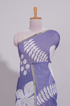 Tropical indigo linen saree with bold white floral and geometric prints finished with a subtle metallic border along with matching blouse