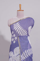 Tropical indigo linen saree with bold white floral and geometric prints finished with a subtle metallic border along with matching blouse