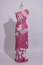 Rani pink linen saree with bold white floral and geometric prints finished with a subtle metallic border along with matching blouse