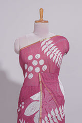 Rani pink linen saree with bold white floral and geometric prints finished with a subtle metallic border along with matching blouse