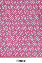 Rani pink linen saree with bold white floral and geometric prints finished with a subtle metallic border along with matching blouse