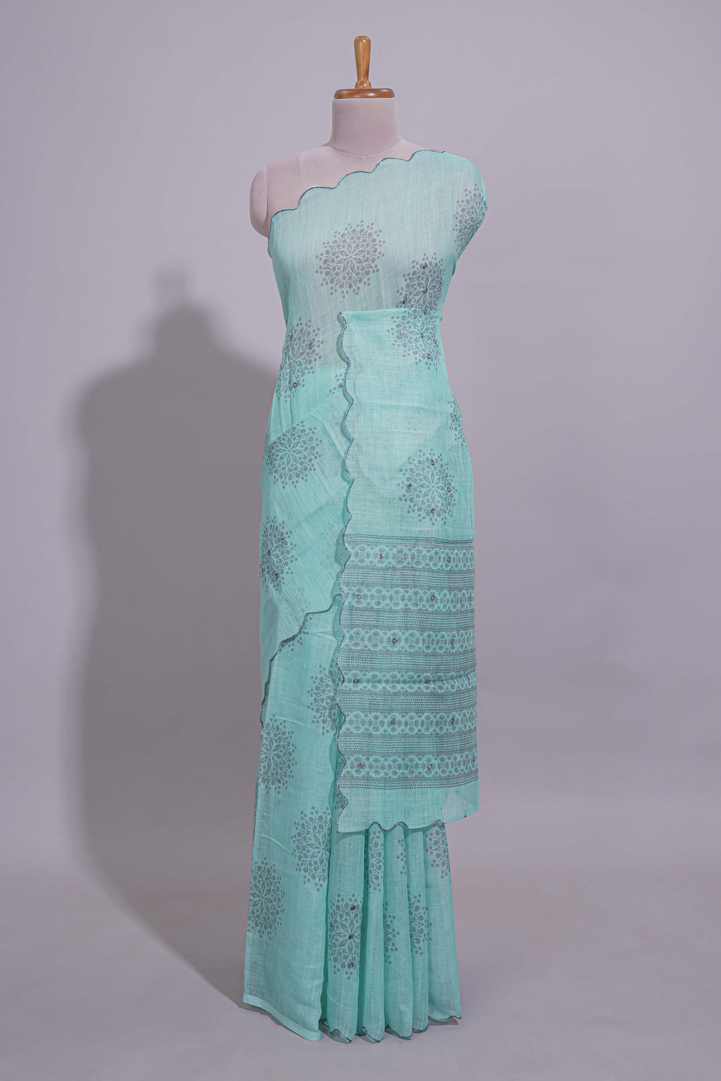 Pastel blue linen saree tree motifs and tiny sequin with scalloped border and matching blouse