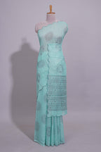 Pastel blue linen saree tree motifs and tiny sequin with scalloped border and matching blouse