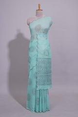 Pastel blue linen saree tree motifs and tiny sequin with scalloped border and matching blouse