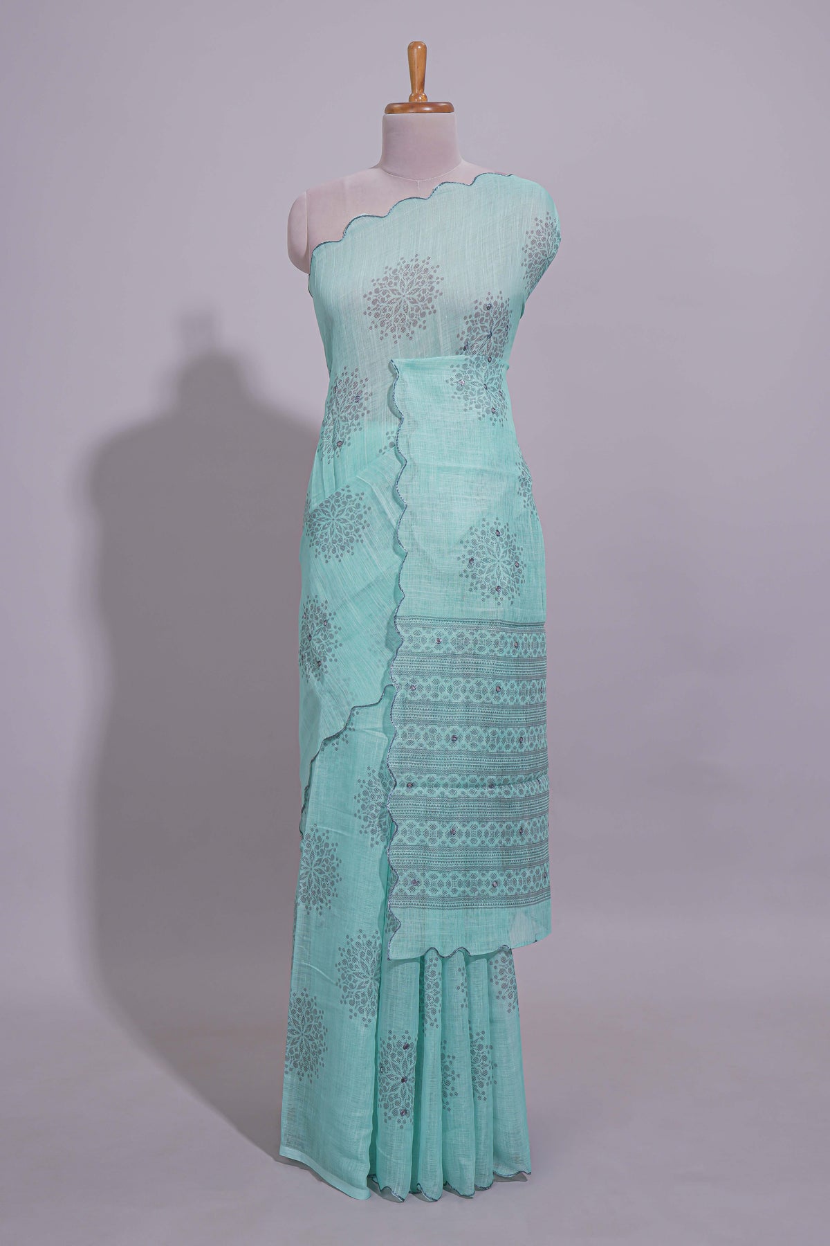 Pastel blue linen saree tree motifs and tiny sequin with scalloped border and matching blouse