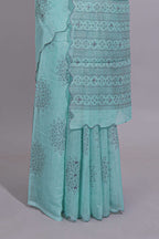 Pastel blue linen saree tree motifs and tiny sequin with scalloped border and matching blouse
